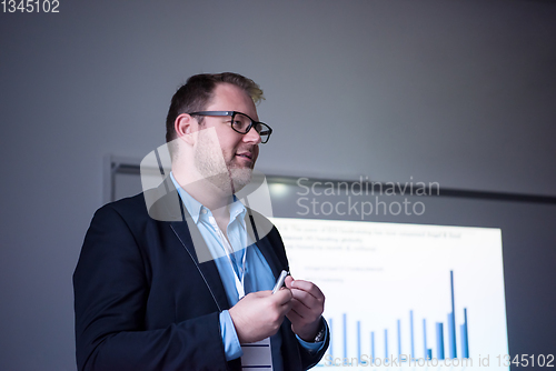 Image of successful businessman giving presentations at conference room