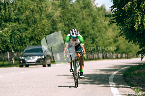 Image of Dnipro, Ukraine - July 12, 2019: athlete with disabilities or amputee training in cycling