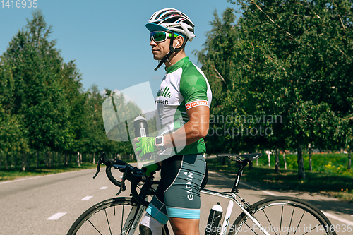 Image of Dnipro, Ukraine - July 12, 2019: athlete with disabilities or amputee training in cycling