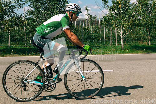 Image of Dnipro, Ukraine - July 12, 2019: athlete with disabilities or amputee training in cycling