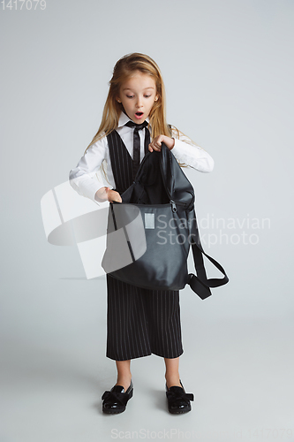 Image of Girl preparing for school after a long summer break. Back to school.