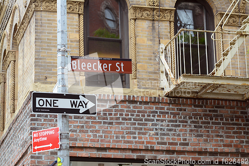 Image of Street sign for Bleecker Street on the corner with Grove Street 