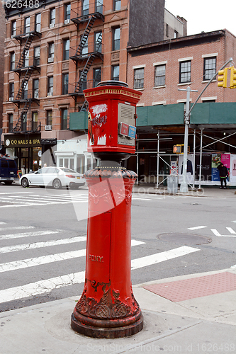 Image of Fire alarm call box on sidewalk in New York City