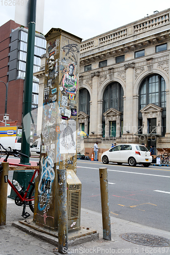 Image of Old-fashioned street vent covered in graffiti and artwork in New