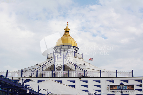 Image of Tower with gold dome at the end of Eastbourne pleasure pier