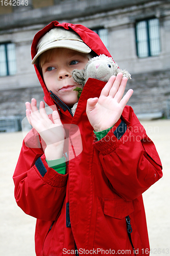 Image of Boy with toy lambkin