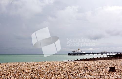 Image of View across pebble beach to Eastbourne pier on the English coast