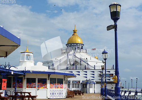 Image of Open deck of Eastbourne pier with seating and arcade entertainme