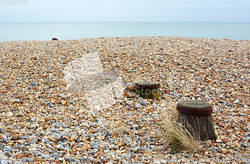 Image of Shingle beach on the English coast with wooden groyne tops