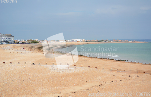 Image of Eastbourne shingle beach in East Sussex, almost deserted on a su