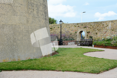 Image of Stone arch in garden wall around historic Wish Tower, Eastbourne