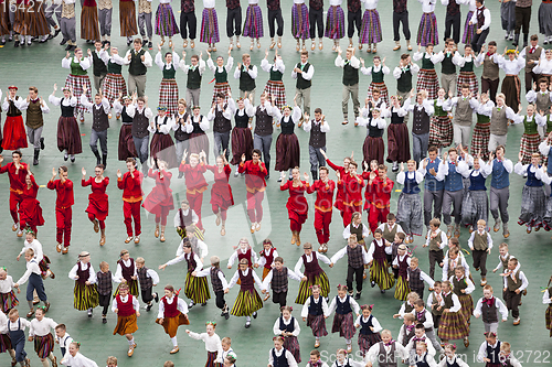 Image of Dancers in traditional costumes perform at the Grand Folk dance 