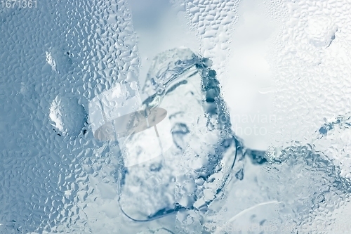 Image of Ice cubes as background texture closeup photo