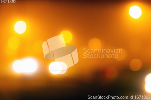 Image of Out of focus light of traffic on a street at night
