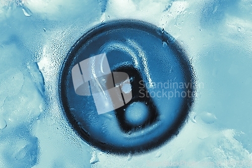 Image of Aluminium tin can in fridge with ice closeup photo