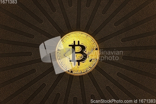 Image of Physical shiny bitcoin agains dark background