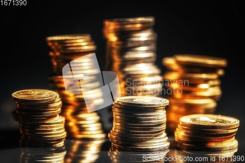 Image of Large pile of coins against dark background