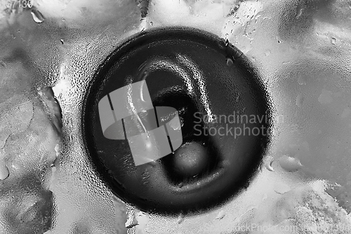 Image of Aluminium tin can in fridge with ice closeup photo