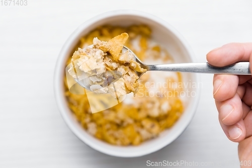 Image of Eating bowl of cereals for breakfast closeup footage