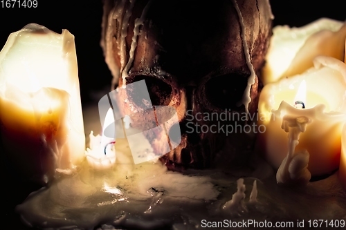 Image of Human skull in candle light closeup