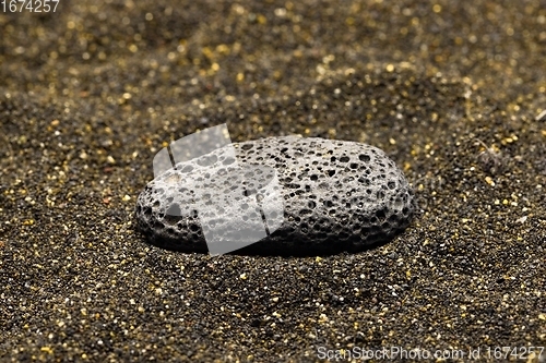 Image of Smoke whirling around small meteorite stone