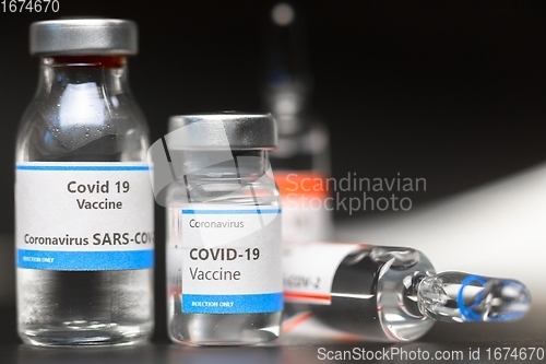 Image of Vaccine for virus in small bottles