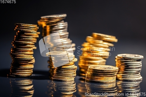 Image of Large pile of coins against dark background