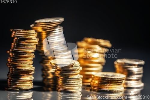 Image of Large pile of coins against dark background