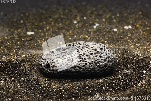 Image of Smoke whirling around small meteorite stone