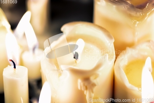 Image of Candles glowing against dark background