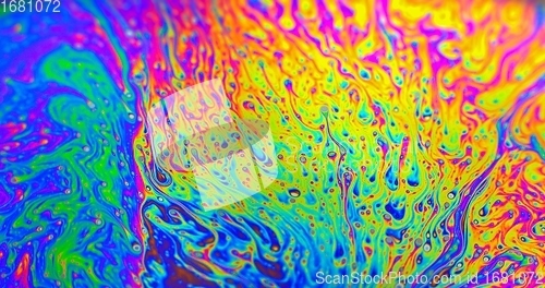 Image of Smooth colorful liquid flowing as background texture