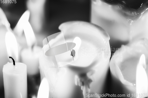 Image of Candles glowing against dark background