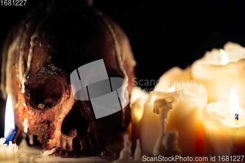 Image of Human skull in candle light closeup
