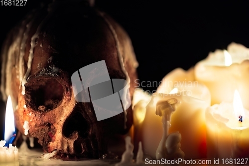 Image of Human skull in candle light closeup