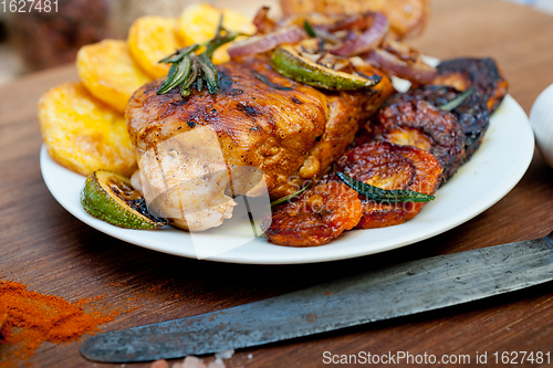 Image of roasted grilled BBQ chicken breast with herbs and spices 