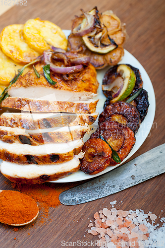 Image of roasted grilled BBQ chicken breast with herbs and spices 