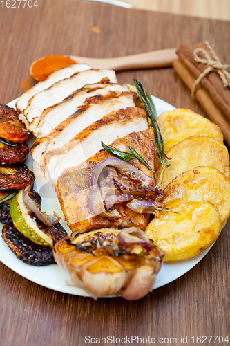 Image of roasted grilled BBQ chicken breast with herbs and spices 