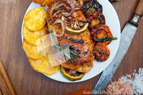 Image of roasted grilled BBQ chicken breast with herbs and spices 