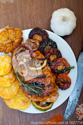 Image of roasted grilled BBQ chicken breast with herbs and spices 