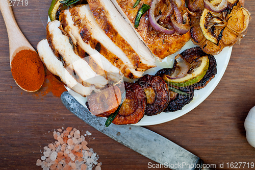 Image of roasted grilled BBQ chicken breast with herbs and spices 