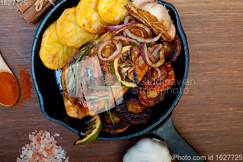 Image of roasted grilled BBQ chicken breast with herbs and spices 