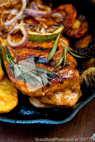 Image of roasted grilled BBQ chicken breast with herbs and spices 