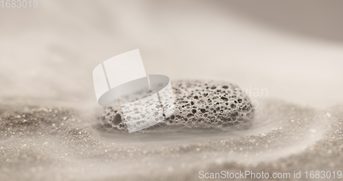 Image of Smoke whirling around small meteorite stone