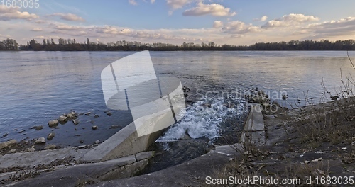 Image of Large sewage tunnel with filth flowing out