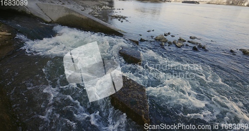 Image of Large sewage tunnel with filth flowing out