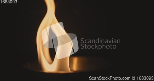 Image of Fire dancing against dark background