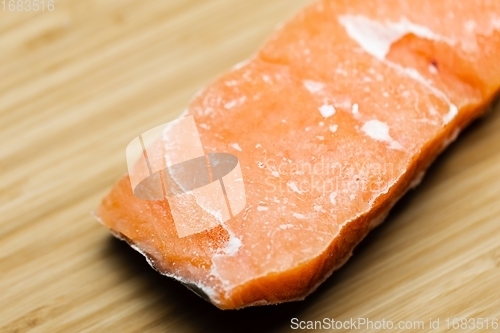 Image of Slice of salmon on the table closeup