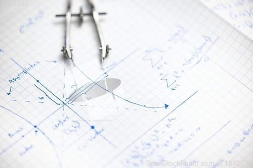 Image of Math exersize in white notebook closeup