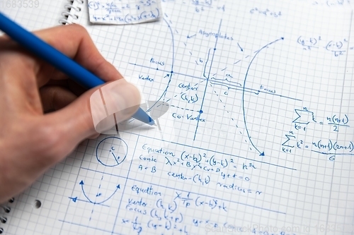 Image of Math exersize in white notebook closeup