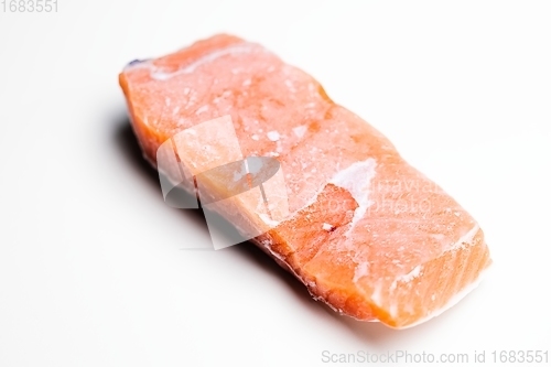 Image of Slice of salmon against isolated white background closeup